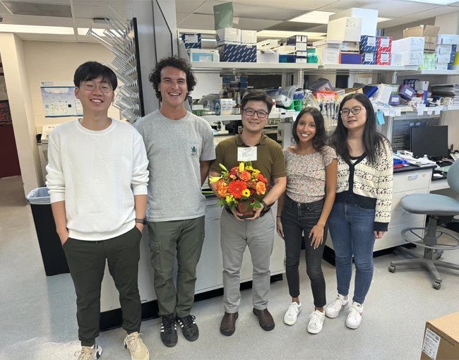 CBN Student with floral bouquet